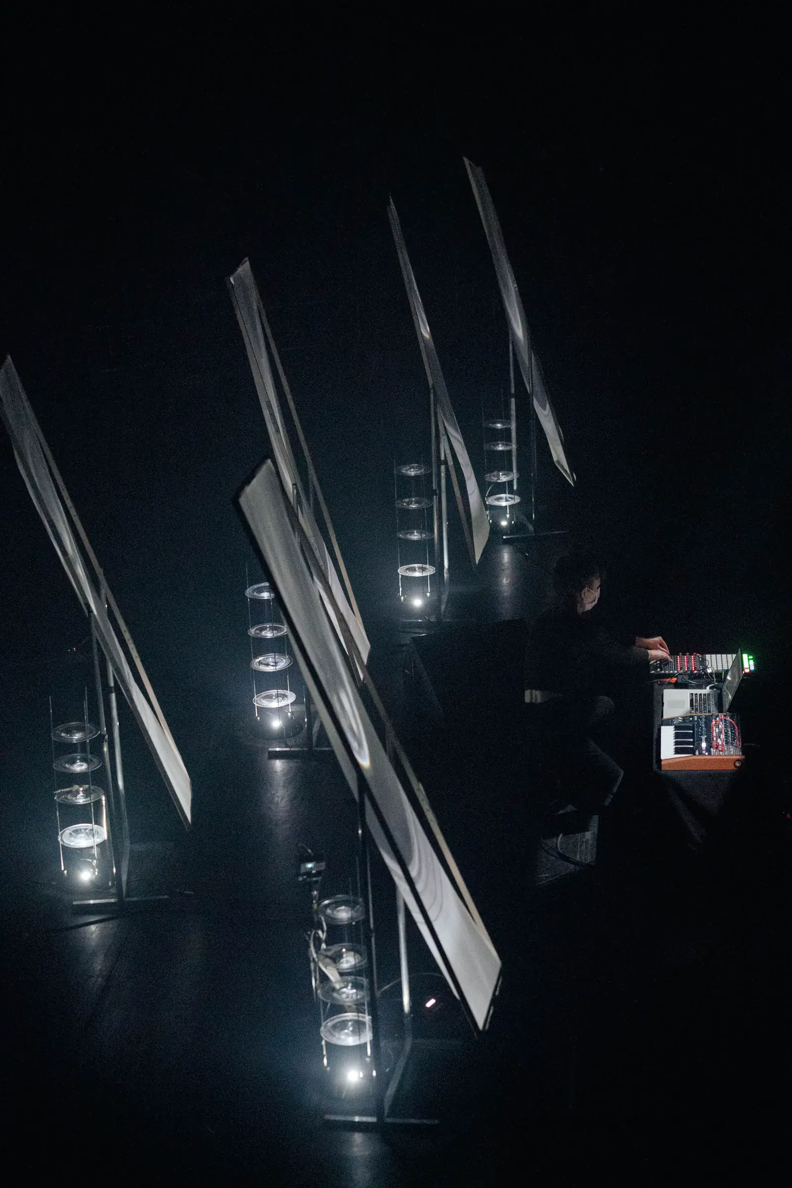 Littoral performance with sculptural reflective panels and lights